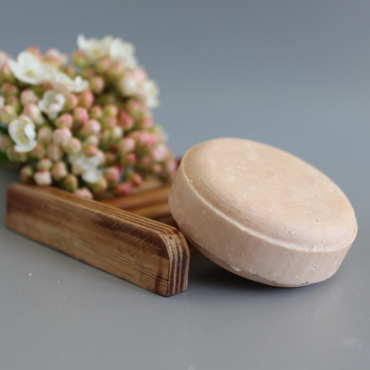 Refreshing Orange and Rosemary Shampoo Bar on soap rack